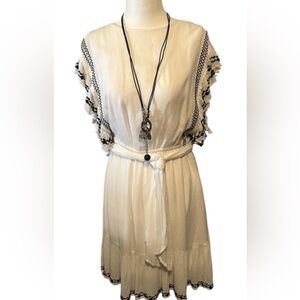 FREE PEOPLE beautiful white dress with black embellishments. Great condition! M